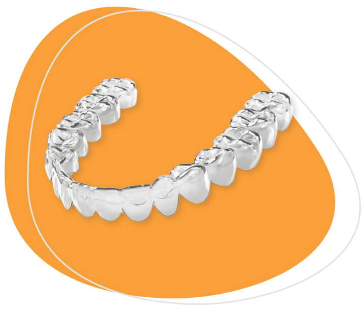 A clear aligner in front of an orange background