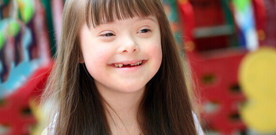 A special needs patient smiling after a pediatric dental appointment